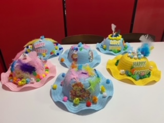 Six Easter bonnets decorated by young people.