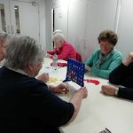 Some members of The Devil's Porridge Museum's Cordite Club playing connect four.
