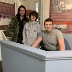 Three students sat in the Chapelcross section of The Devil's Porridge Museum.