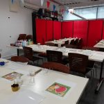 Tables arranged for food and a craft activity in The Devil's Porridge Museum's education room.