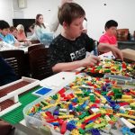 Some young people building Lego.