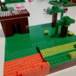 Minecraft inspired Lego build of a house, some lava and trees.