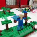 Minecraft inspired Lego build of a person and some trees.