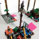 A completed Lego build which features a Lego Mini figure very high up in the air.